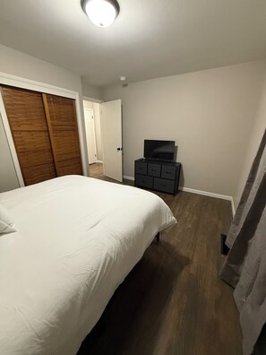 Queen bedroom with tv