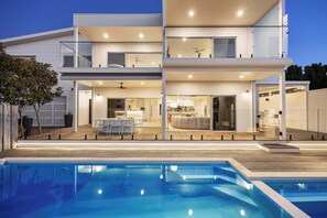 Front Pool Facade I The Front Pool Facade enhances the aesthetic appeal of the home, featuring a beautifully designed pool area that complements the architectural style. 