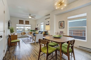 Bright and welcoming! This open dining space is perfect for shared meals, flowing seamlessly into the cozy living area..