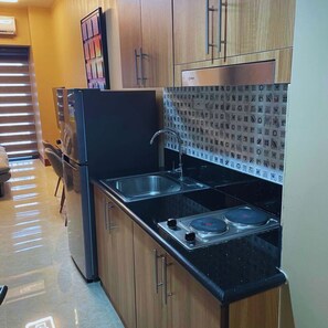 Kitchen with cooking pots and pans and utensils