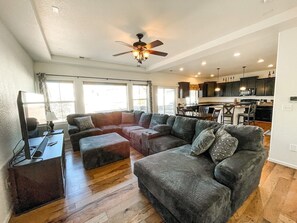 Relax in this spacious living area while streaming your favorite shows on the Smart TV