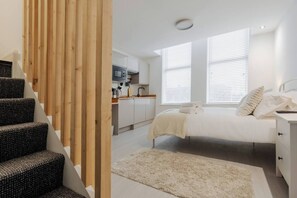 Room Features: 

-1 x Double Bed 
-1 x Sofa Bed 
-Plugs in bedside table (direct USB plug available) 
-Dedicated workspace
 -Smart TV with Netflix 
-Private mini fridge with freezer 
-Open space with hangers 
-Kitchenette
-Washing machine