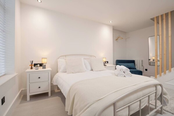 Room Features: 

-1 x Double Bed 
-1 x Sofa Bed 
-Plugs in bedside table (direct USB plug available) 
-Dedicated workspace
 -Smart TV with Netflix 
-Private mini fridge with freezer 
-Open space with hangers 
-Kitchenette
-Washing machine