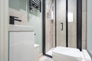 Full Bathroom: 
- Sink 
- Toilet 
- Electric Shower
