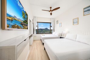 Relax in your bedroom with 2 queen-size beds and 55" Smart TV