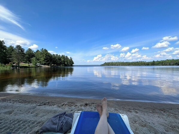 100% private! 400',  sandy bottom with gradual grade. Boat launch to the left.