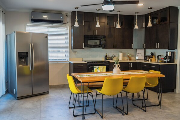 Open concept Kitchen, stocked with all required essentials and glassware 