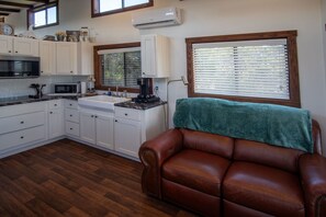 The kitchen is adjacent to the living room
