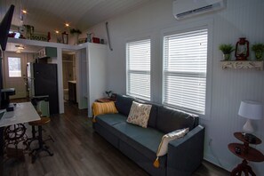 The living space is open to the kitchen