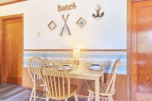 Cozy wooden dining table for three — perfect for intimate meals and morning coffee. 🍽️☕