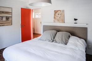 First bedroom with kingsize bed and bathroom ensuite
