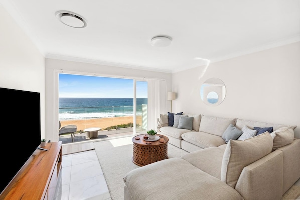 Lounge on the L-shaped sofa and unwind with a movie on the TV in the living room—all while the waves provide the perfect soundtrack to your stay.