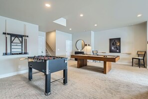 Downstairs Game Room with Pool Table and Foosball