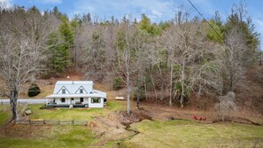 View of side of house from the hillside.