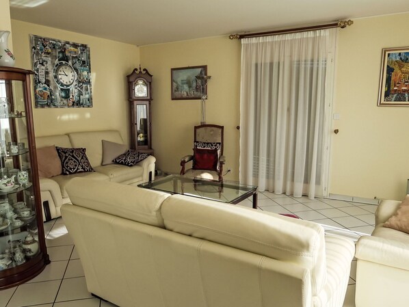 Furniture, Couch, Interior Design, Flooring, Wall, Floor, Living Room, Room, Picture Frame, Lighting