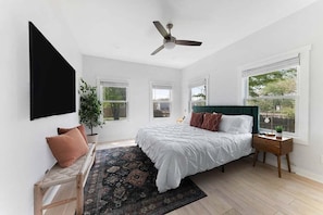 Boutique king bedroom with vibrant accents.