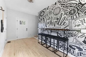 Local art meets luxury in this mural-accented corner.
