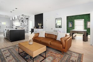 Spacious living with curated decor and natural light.