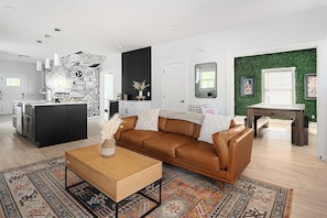 Spacious living with curated decor and natural light.