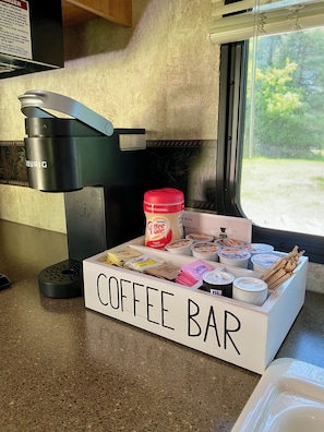 Keurig, gas stove, oven, sink, fridge and kitchen complete with the essentials.