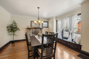 Dining area that seats 6 comfortably with additional window seating.