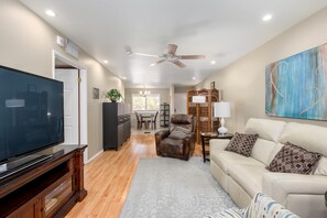 Living room has large smart TV.
