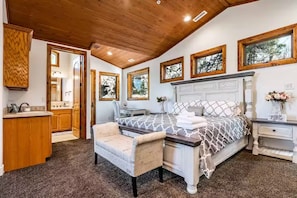 Bedroom #2, Master suite, shows door to bathroom and small coffee station.