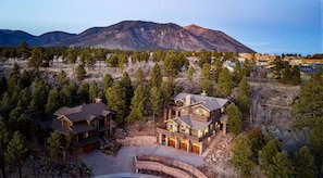 shows home nestled on hillside with Mount Elden closeby