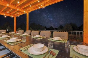 Enjoy a relaxing evening with 2 aluminum tables that seat 12 when together and 14 when separated. The extra chairs are on the deck.