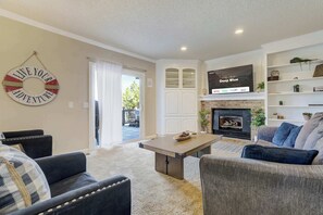 Relax in the inviting living room, featuring plush seating, a cozy fireplace, and a Smart TV—perfect for movie nights or unwinding after a day of adventure.
