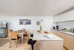 Surfside 34 Zinc, Newquay: The open-plan living space features kitchen, dining and sitting areas