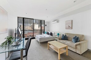 The living area with a 2-seater couch.