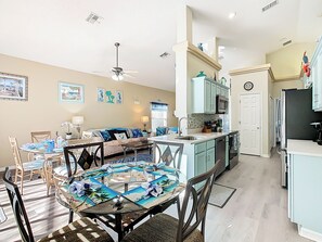 - Fully stocked kitchen with modern appliances and beach toned cabinetry for easy meals
- Two dining areas perfect for group gatherings, game nights, or family breakfasts
- Nautical accents and sunny vibes flow through every inch of this bright open layout