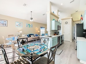 - Fully stocked kitchen with modern appliances and beach toned cabinetry for easy meals
- Two dining areas perfect for group gatherings, game nights, or family breakfasts
- Nautical accents and sunny vibes flow through every inch of this bright open layout