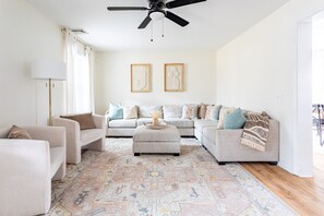 Neutral living room with ample seating for all