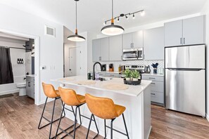 Fully equipped kitchen with all the tools you need for a perfect culinary experience. Enjoy the convenience of having everything at your fingertips!