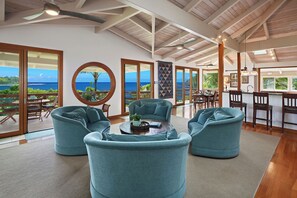 Living area is open and spacious with high vaulted ceilings