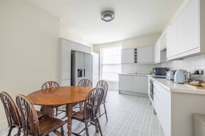 Kitchen with modern appliances and American style fridge freezer