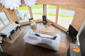 TV, sofas, coffee table, dining area