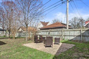 Enjoy the fresh air and relax in the spacious backyard patio, perfect for sitting back and enjoying the moment after a day of exploring