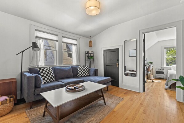 Kick back, relax, and make yourself at home. This bright + comfy living room is the perfect spot to unwind after a day exploring Milwaukee.