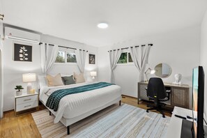 Cozy bedroom with a workspace that inspires creativity and productivity.