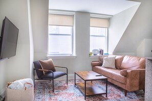 Living room and kitchen with bar stool seating