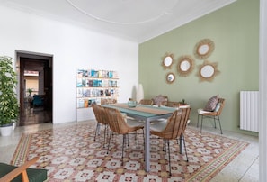 There is a beautiful light filled dinning room.