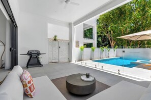 Lounge in style on the sun-drenched patio, where a spacious seating area and gas BBQ invite you to savour alfresco feasts, sip cocktails, and soak in the tranquil coastal ambience.
