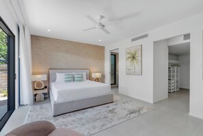 Indulge in the tranquillity of the primary suite with a king bed, refined décor and a private TV for private entertainment.