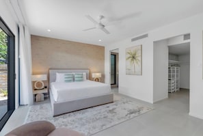 Indulge in the tranquillity of the primary suite with a king bed, refined décor and a private TV for private entertainment.