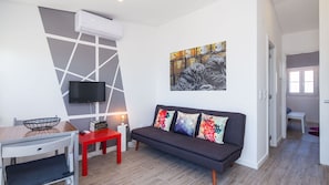 A comfortable living area with cable TV and AC for your convenience. #lisbon #apartment #vacations #decor