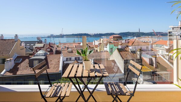This sunny balcony is the perfect spot for an outdoor meal or a cup of wine, while you enjoy this lovely view #sunny #perfectview #portugal #pt #lisbon