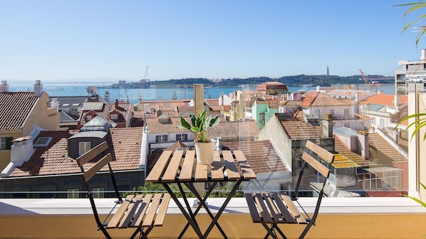 This sunny balcony is the perfect spot for an outdoor meal or a cup of wine, while you enjoy this lovely view #sunny #perfectview #portugal #pt #lisbon
